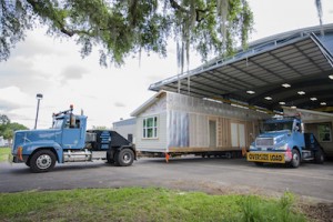 Santa Fe College, Habitat for Humanity and the Builders Association of North Central Florida working together to load and ship the 6th Santa Fe Habitat House in the SF Charles R. Perry Construction Institute on Thursday, May 19, 2016. Photos by Aaron Daye/Santa Fe College