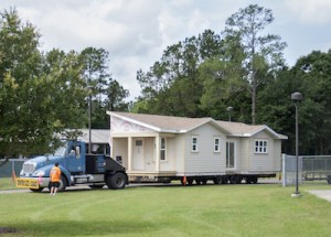 Santa Fe College, Habitat for Humanity and the Builders Association of North Central Florida working together to load and ship the 6th Santa Fe Habitat House in the SF Charles R. Perry Construction Institute on Thursday, May 19, 2016. Photos by Aaron Daye/Santa Fe College