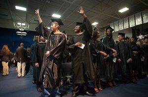 Jonathan Vann and Jeremy Gates (Both have photo release signed) waves to the crowd during the Santa Fe College Fall Commencement Ceremony on Friday, Dec. 9, 2016 in Gainesville, Fla. (Photo by Matt Stamey/Santa Fe College)