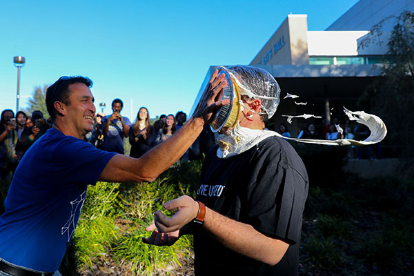 SF Associate Director of Student Life Doug Bagby hits Student Body  President Cale McCall with a pie in the face.