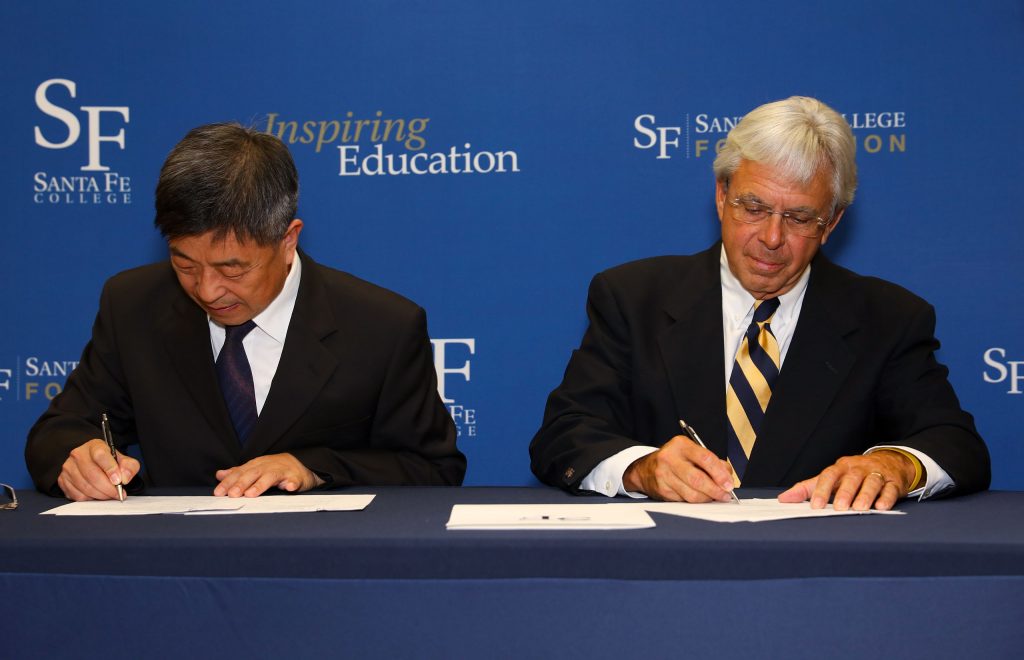 JPEC President Huang Zujie and SF President Jackson Sasser singing the articulation agreement.