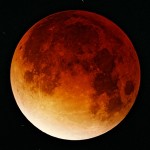 The moon turning a deep red during a total lunar eclipse in November 2003.