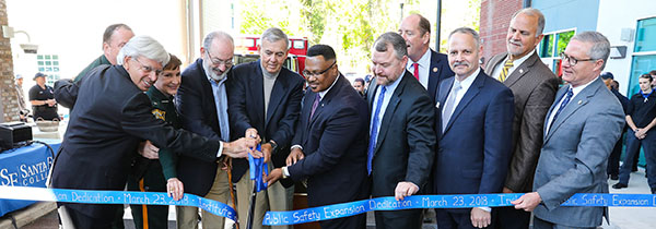 President Dr. Jackson Sasser and other dignitaries, cut a ribbon during the dedication of the Institute of Public Safety at the Santa Fe College Kirkpatrick Center on Friday, March 23, 2018