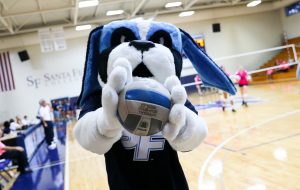 SF mascot Caesar holding a volleyball.
