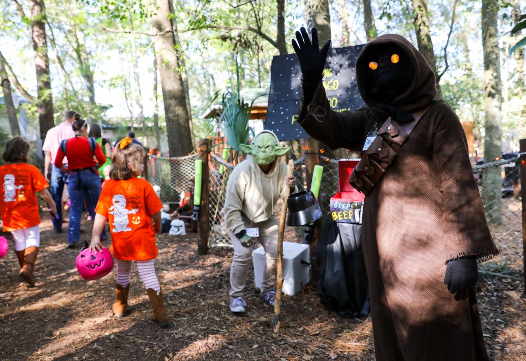 Families make their way through the Santa Fe College Teaching Zoo during the annual Boo at the Zoo event on Tuesday Oct. 31, 2017 in Gainesville, FL. Zoo faculty, staff and students dress in costumes and pass out candy to trick-or-treaters. (photo by Matt Stamey/Santa Fe College)