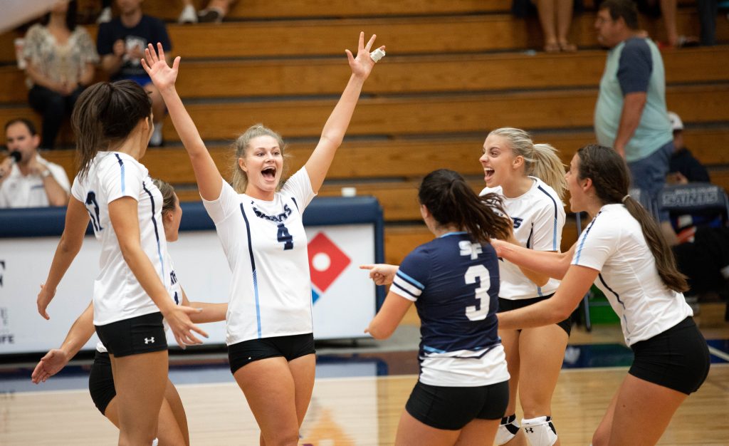 Leah Wilcox and the Santa Fe College volleyball team celebrate a victory