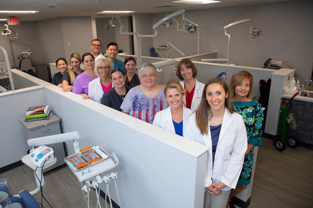 The staff at the SF Dental clinic welcome patients to their newly renovated office