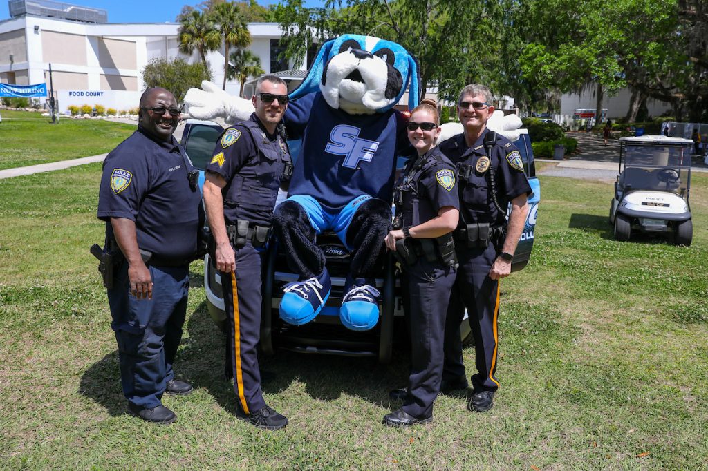 Caesar the Santa Fe College mascot with officers from the Santa Fe College Police Department