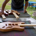Students in SF's Davis Center make guitars as part of their Wide World of Science class.