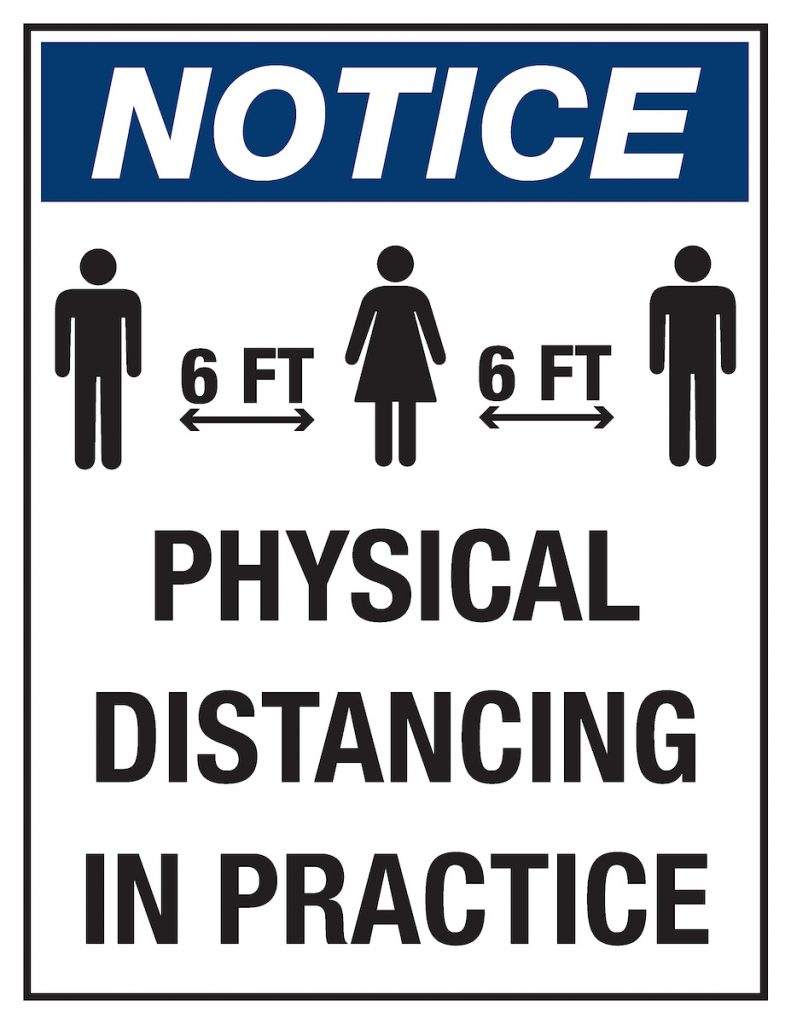 An example of one of the COVID-19 signs around college workspaces.