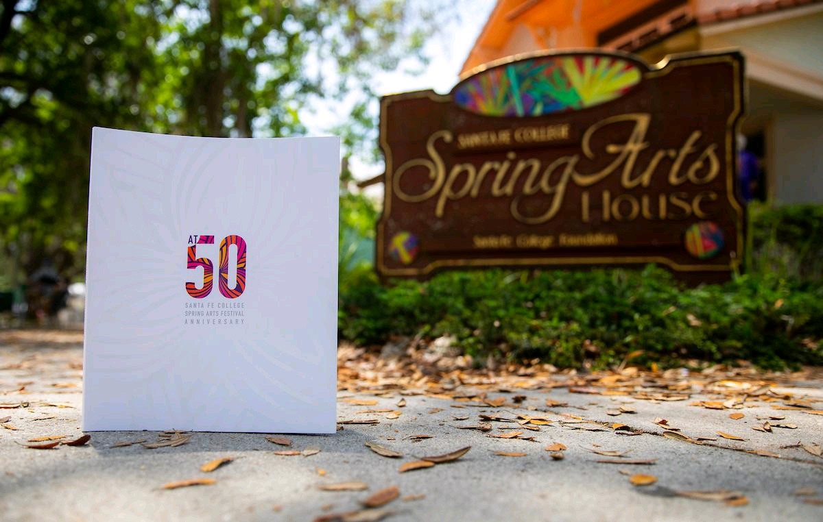 The 50th Anniversary Spring Arts Festival book photographed outside the SF Spring Arts House.