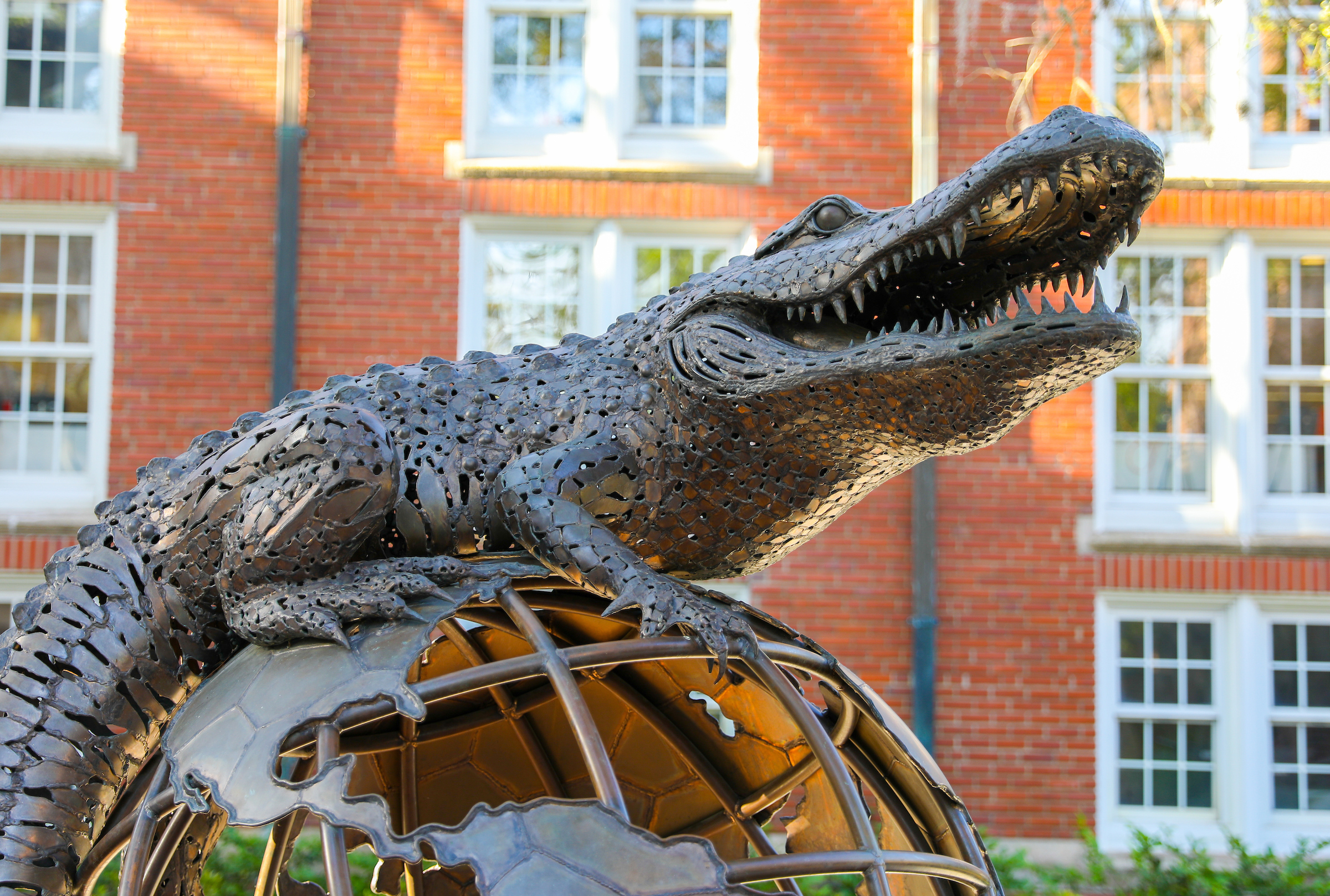 Gator on a globe statue
