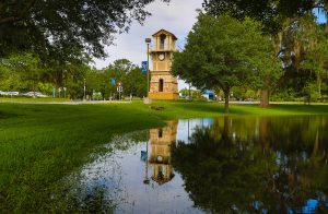 Picture of Santa Fe College's Clock Tower reflecting off a retention pond near the Fine Arts Hall