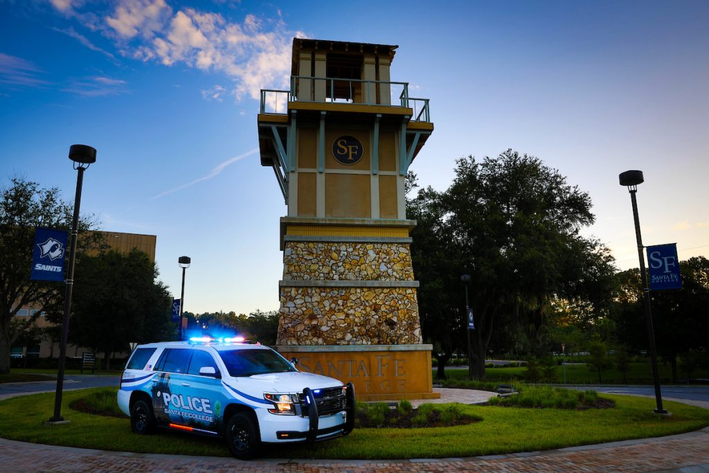 A Santa Fe College police patrol vehicle in front of the SF Clock Tower.