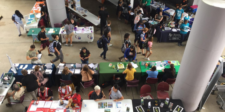 view of tabling event with people and papers