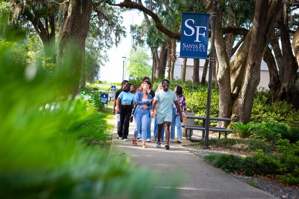 Students are walking outside on Santa Fe College's Northwest Campus.