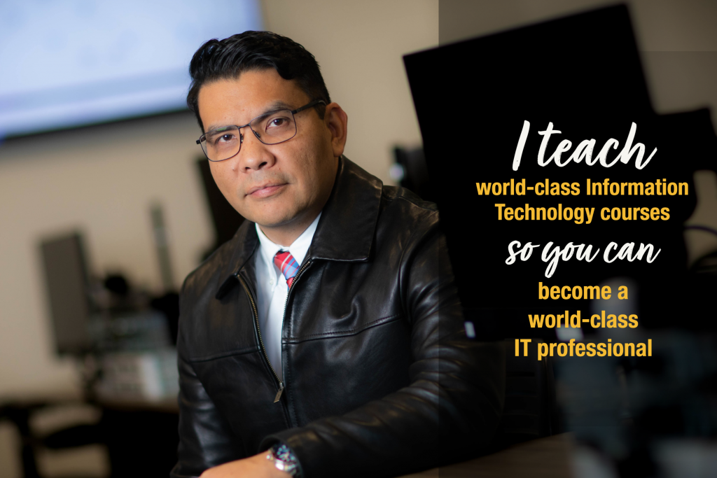 Man with medium skin, wearing glasses and a suit jacket sits for a portrait. Caption: I teach world-class information technology courses so you can become a world-class IT professional.