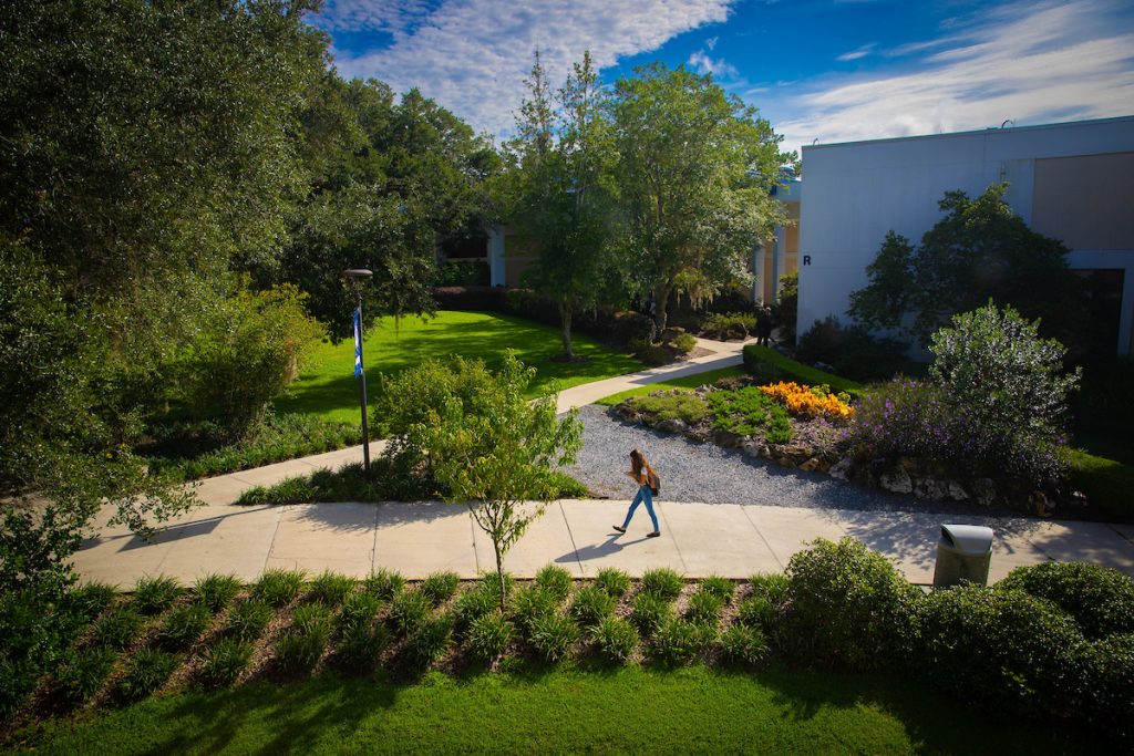 A student walks past Building P during the first week of the Fall 2022 term at Santa Fe College on Aug. 22, 2022 in Gainesville.