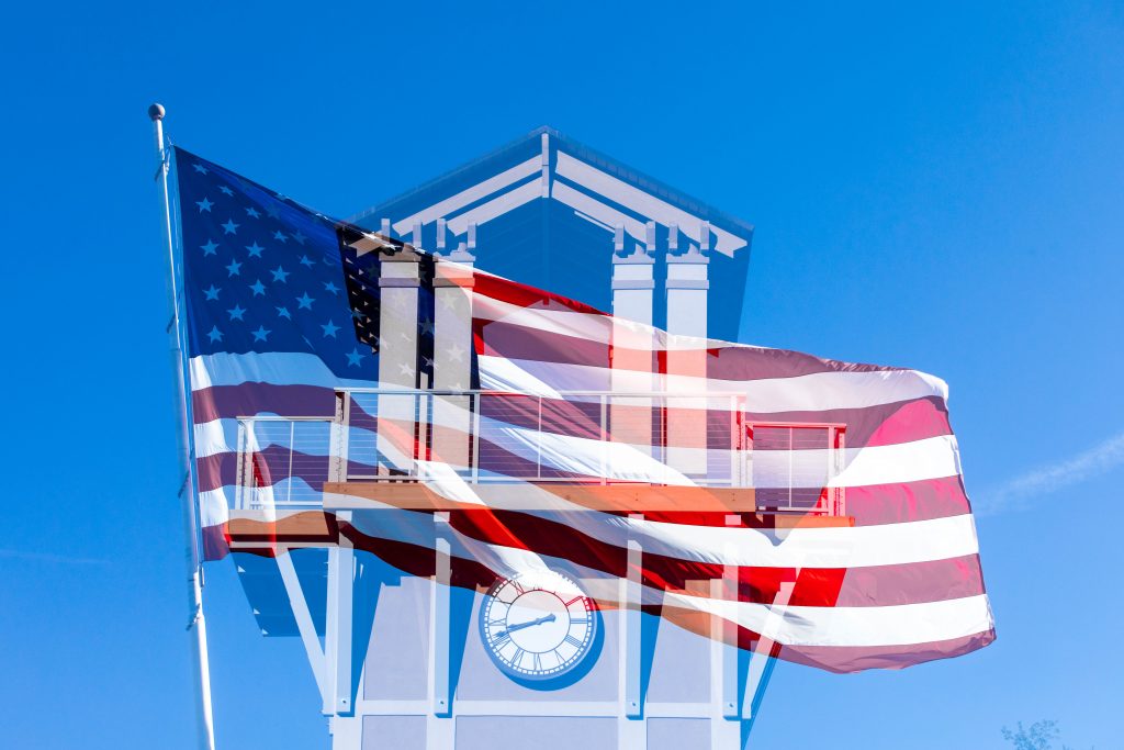 Multiple exposure image of the Santa Fe College clock tower and American flag