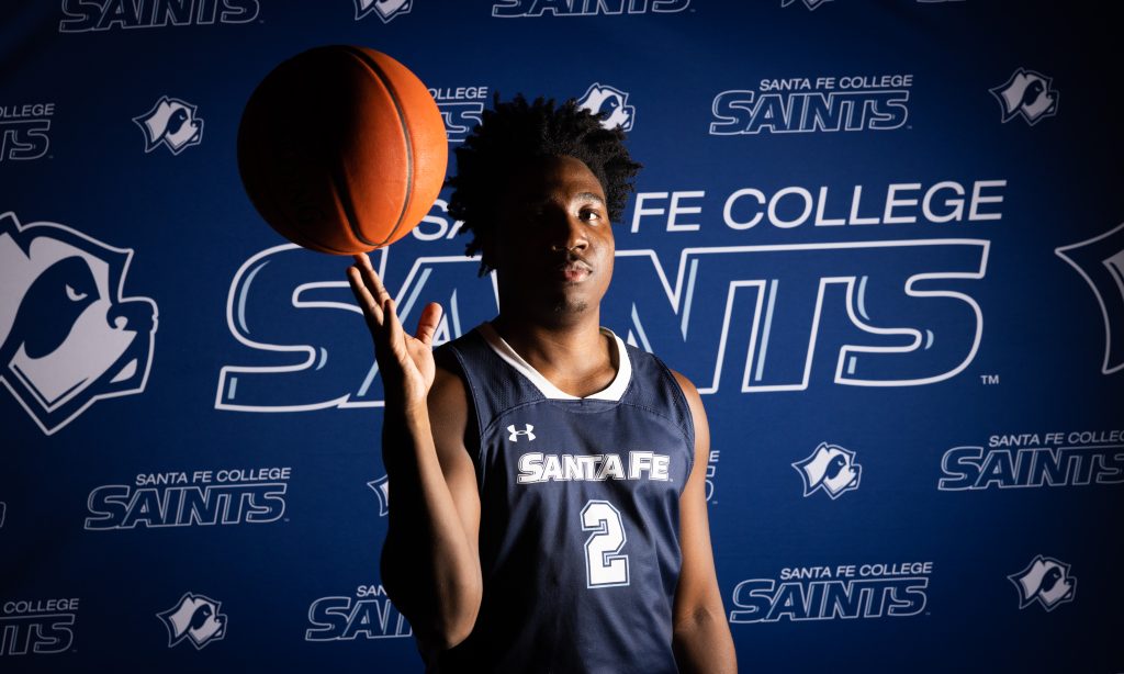 Santa Fe College Saints Men’s Basketball player Jonathan Renois with a basketball perched on his fingers