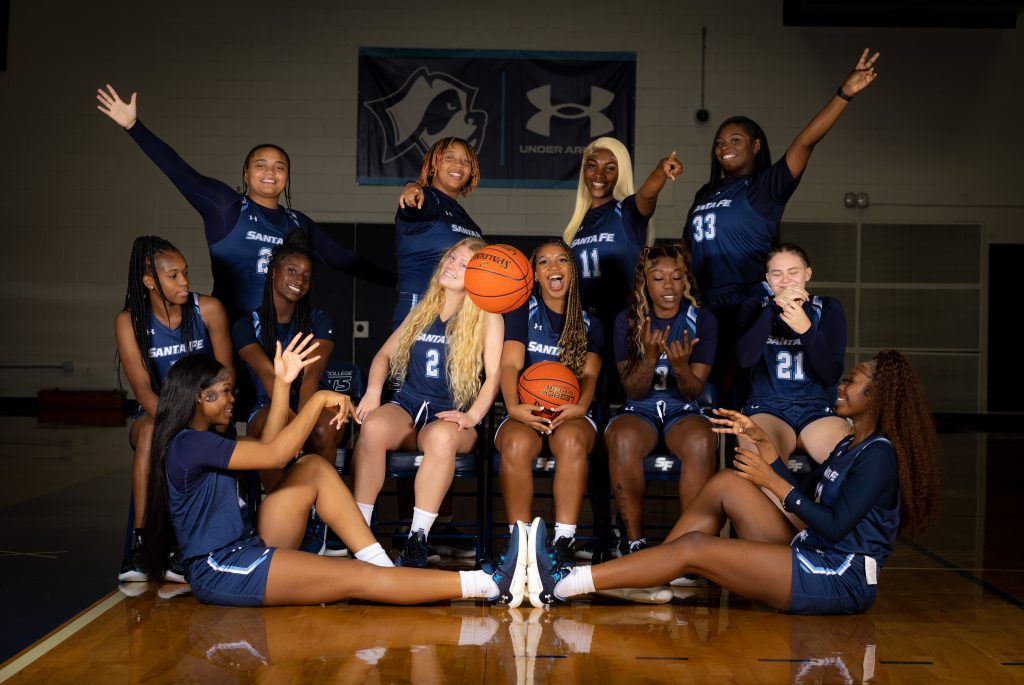 The Santa Fe College Saints Women’s Basketball Team sitting and standing in a variety of playful poses.