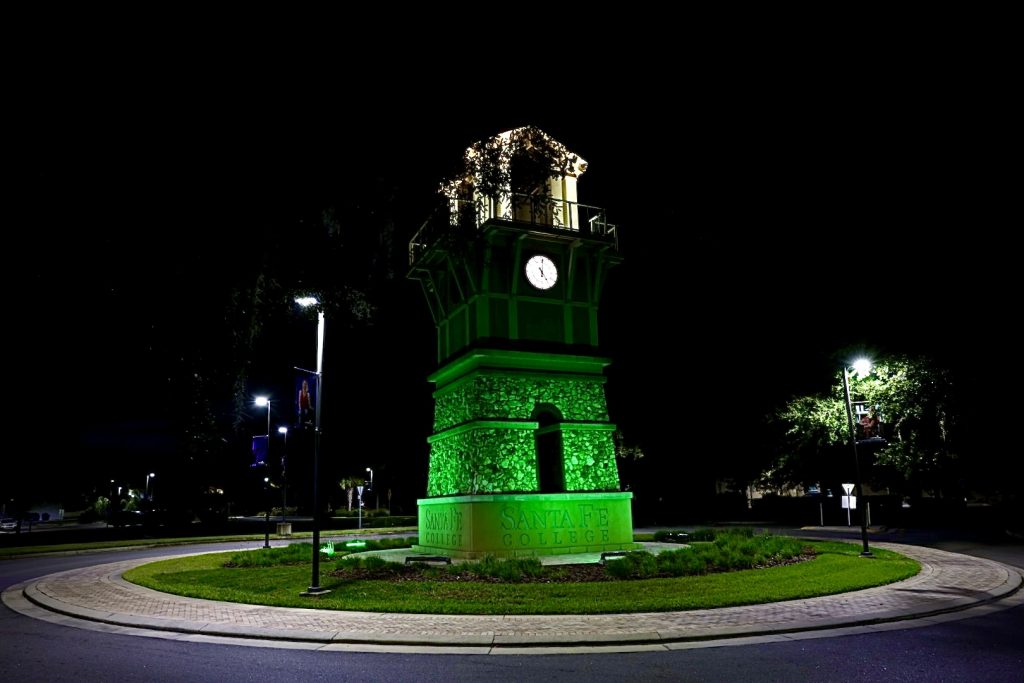 The Santa Fe College clocktower, located on the Northwest Campus, is lit up green in honor of Veterans Day.
