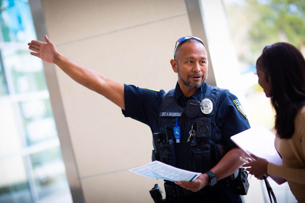 A Santa Fe College Police Department officer points directions to someone on Santa Fe College's Northwest Campus.