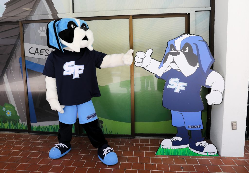 Santa Fe College mascot Caesar Saint poses next to his likeness outside R-01 on Santa Fe College's Northwest Campus.