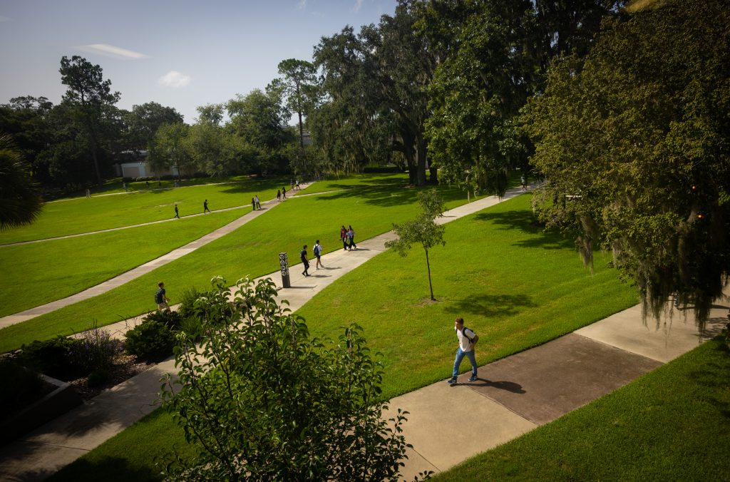 Students walking on sidewalks on Santa Fe College's Northwest Campus