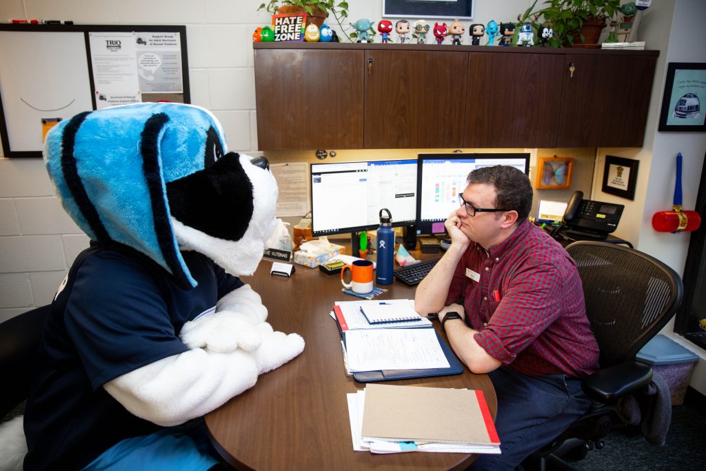 Caesar the Santa Fe College Mascot talks with Steve Vutsinas at the Santa Fe College Counseling Center.