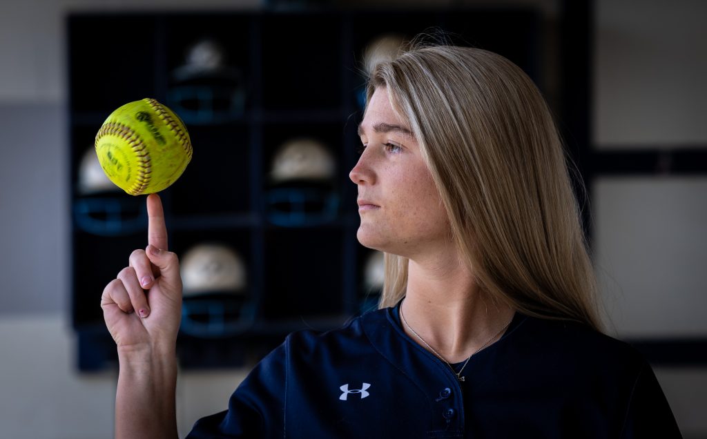 Santa Fe College Saints Softball player Karris Rhine balances a softball on her finger.