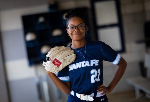 Santa Fe College Saints Softball player Jayla Clark wearing a softball glove