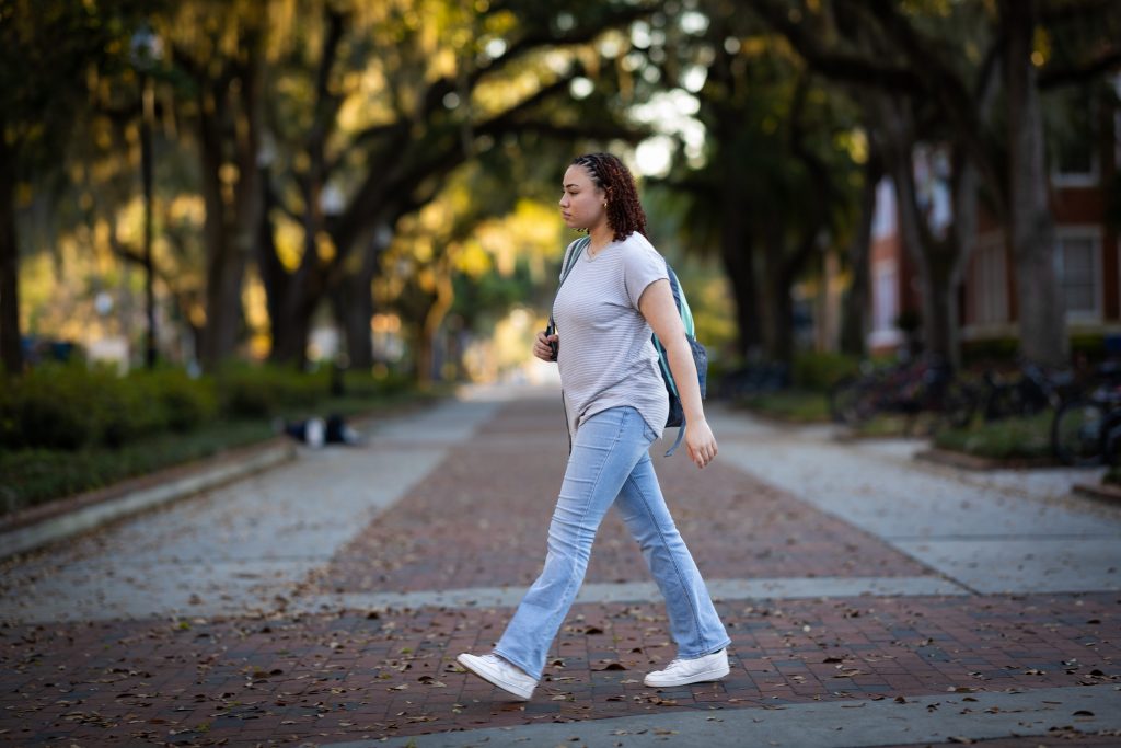 Maya Frazier walking on a sidewalk