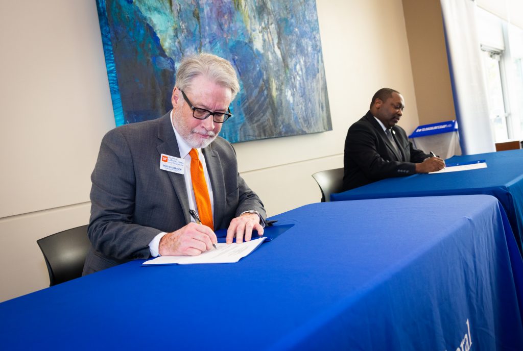 Santa Fe College President Paul Broadie II, Ph.D. and Dean of the College of Liberal Arts and Sciences Dr. David Richardson during a signing ceremony at the Fine Arts Hall to formalize the partnership giving Santa Fe College students guaranteed admissions to 17 University of Florida programs in the College of Liberal Arts and Sciences.