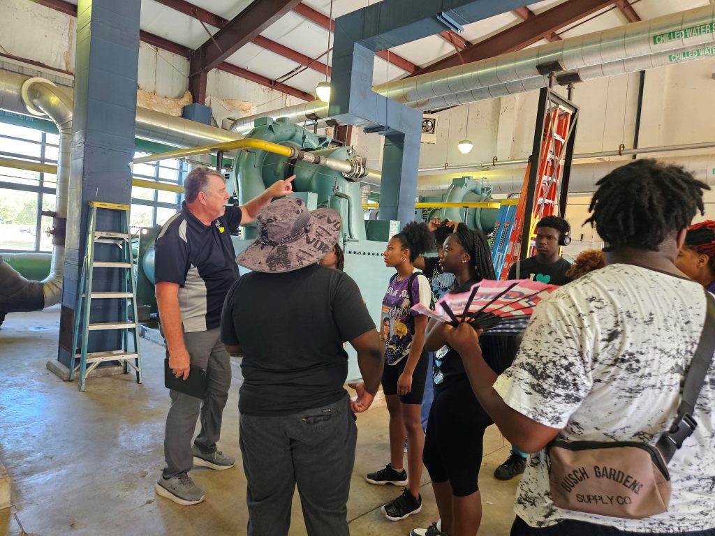 A group of people in an HVAC chiller facility