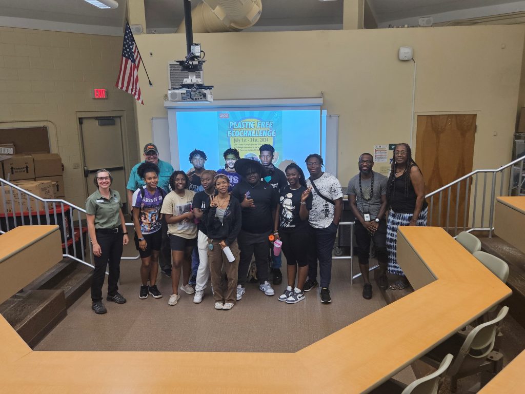 A group of people standing in a room