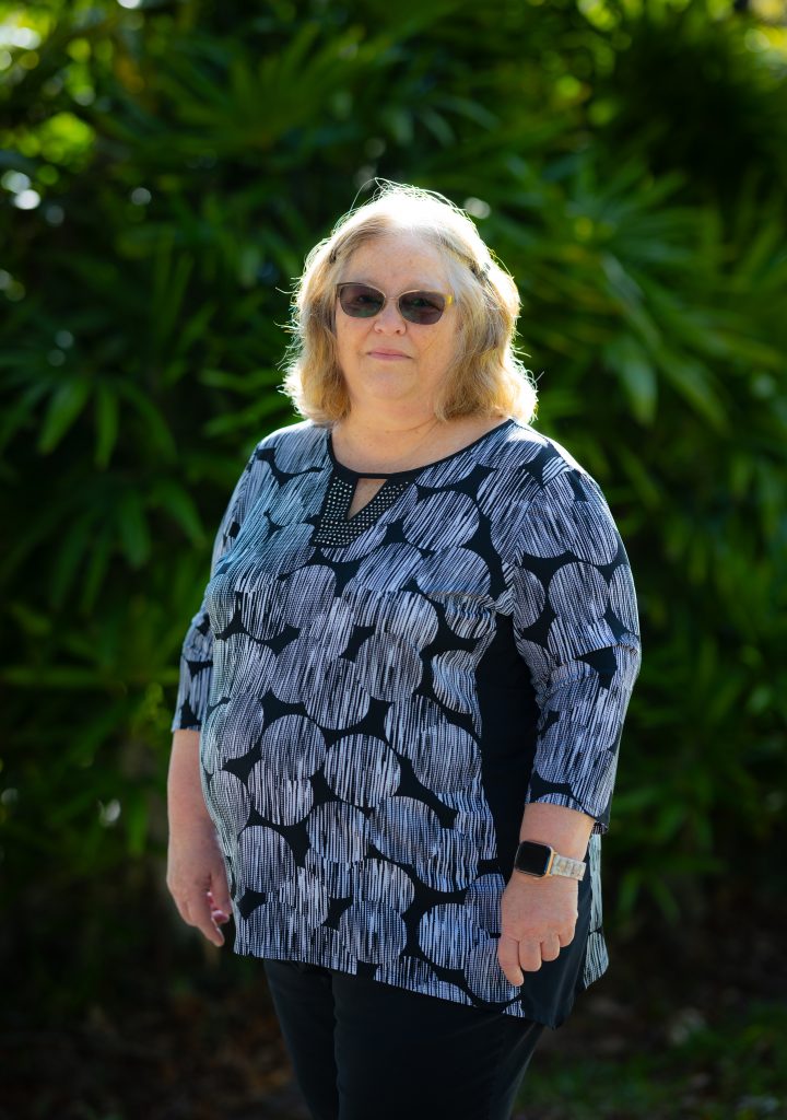 Teri McClellan posing outside for a photograph.